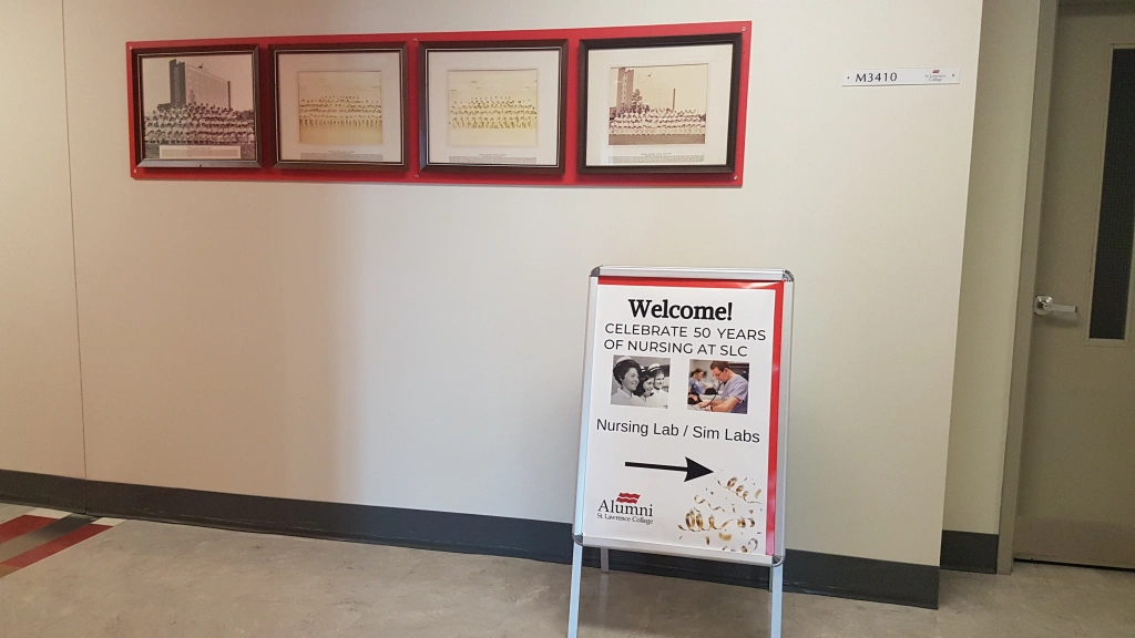 Graduating Class photos adorn the corridors.
