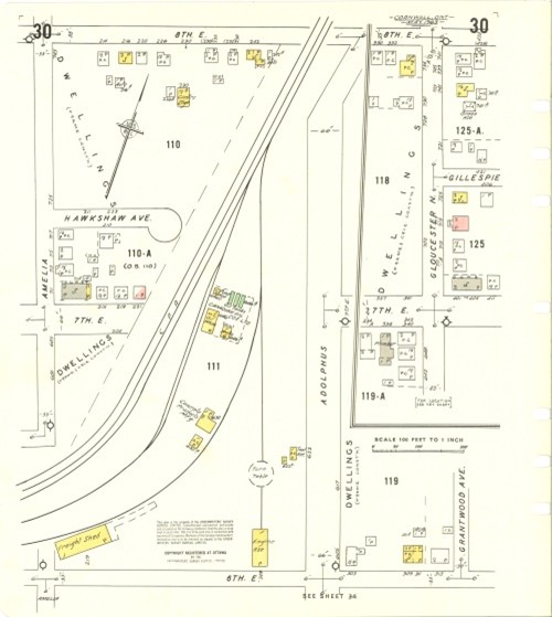 Vintage map depicting a neighborhood layout with numbered plots and labeled streets. Key landmarks and structures are marked in yellow and pink.