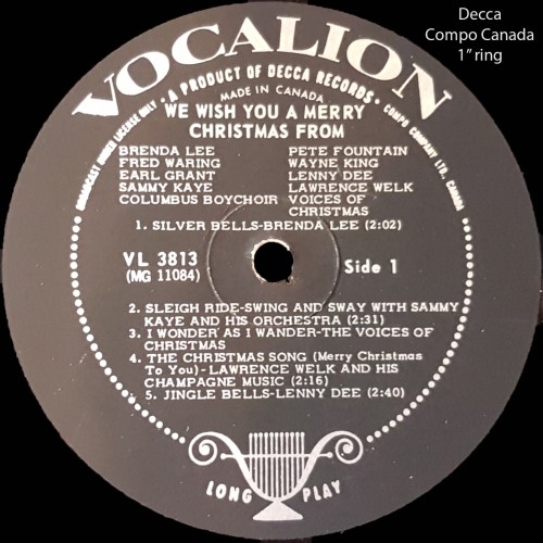 Alt text: "Black vinyl record label with 'Vocalion' at the top, featuring Christmas songs by various artists. Central hole and track details visible."