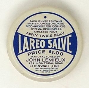 Round white tin labeled “Lareo Salve” with a blue design, price $1.00, instructions for use, and manufacturer info from Cornwall, Ontario.